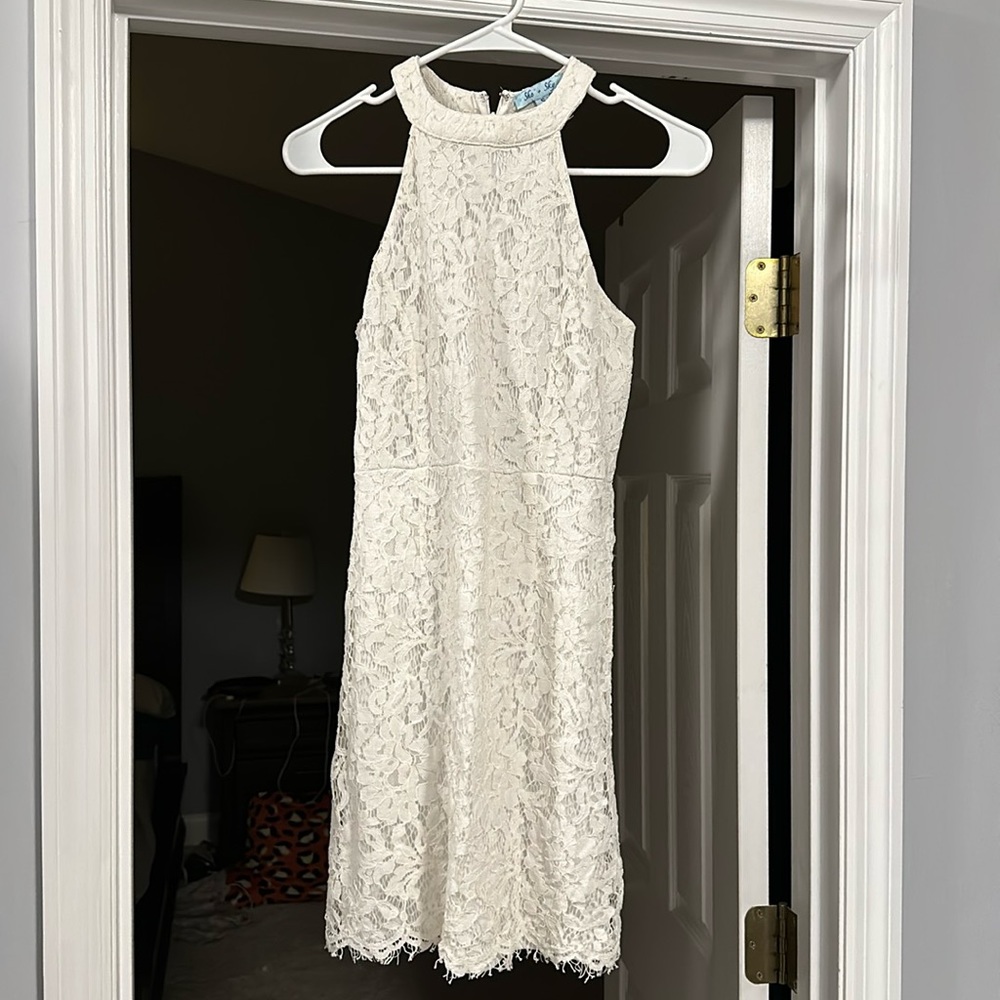 Short, white lace dress with unlined back. Size small